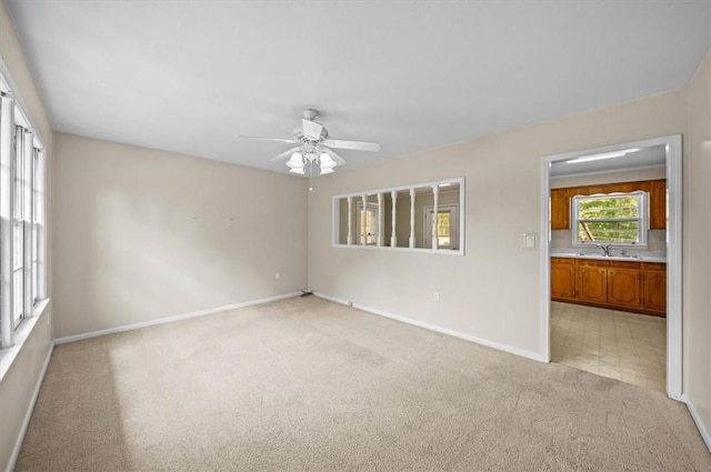 100 Colonial Ct, West Union, SC 29696 - unfurnished room featuring light carpet, baseboards, a ceiling fan, and a sink