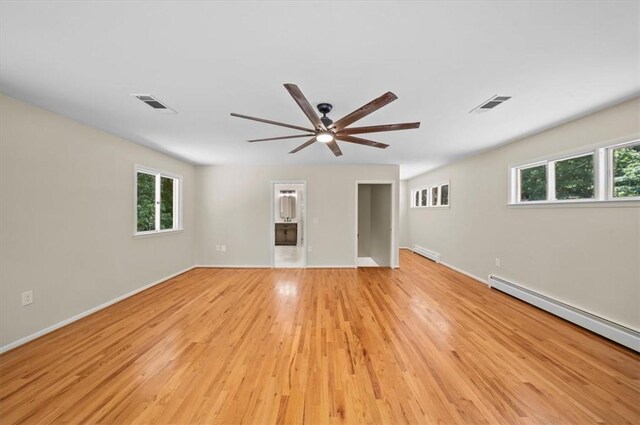 333 Woodland Way, Clemson, SC 29631 - unfurnished room with healthy amount of natural light, a ceiling fan, light wood-style floors, and a baseboard heating unit