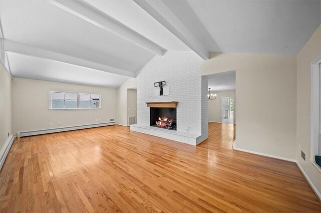 333 Woodland Way, Clemson, SC 29631 - unfurnished living room featuring a baseboard heating unit, light wood-type flooring, a fireplace, and healthy amount of natural light