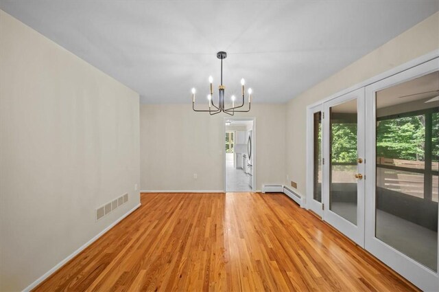 333 Woodland Way, Clemson, SC 29631 - unfurnished dining area featuring a chandelier, light wood-style floors, french doors, and a baseboard radiator