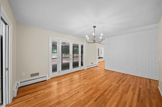 333 Woodland Way, Clemson, SC 29631 - unfurnished room featuring baseboard heating, brick wall, a chandelier, light wood finished floors, and french doors