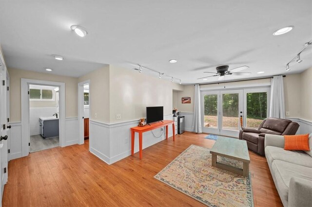 333 Woodland Way, Clemson, SC 29631 - living area with rail lighting, a wainscoted wall, healthy amount of natural light, a ceiling fan, and light wood finished floors