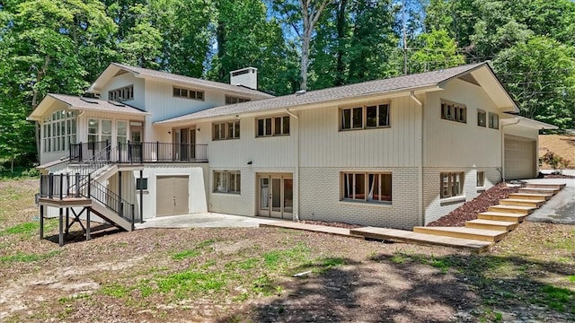 333 Woodland Way, Clemson, SC 29631 - back of house with stairs, brick siding, a chimney, a patio area, and view of scattered trees