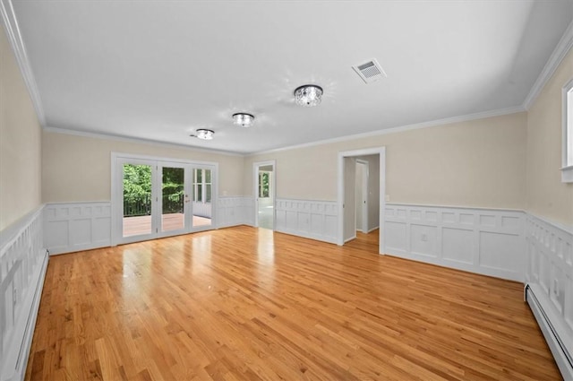 333 Woodland Way, Clemson, SC 29631 - unfurnished room featuring ornamental molding, light wood-style flooring, wainscoting, and baseboard heating