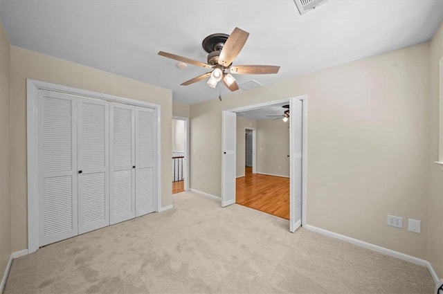 333 Woodland Way, Clemson, SC 29631 - unfurnished bedroom featuring light colored carpet, a closet, and a ceiling fan