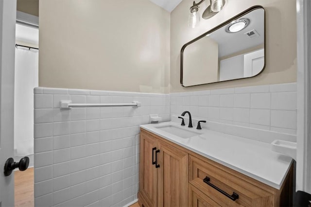333 Woodland Way, Clemson, SC 29631 - bathroom featuring tile walls, vanity, a wainscoted wall, and curtained shower
