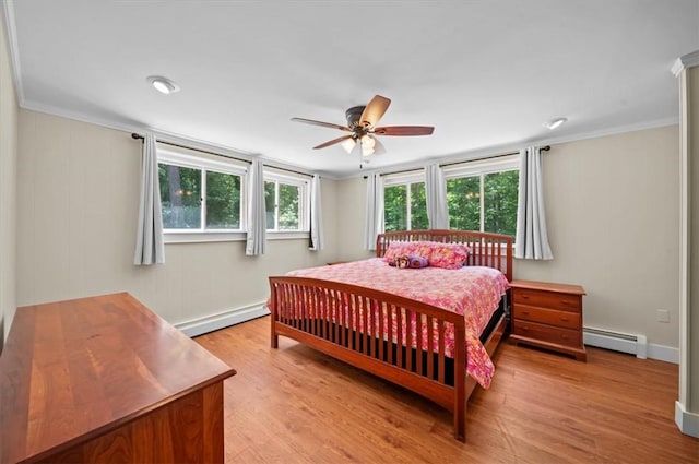 333 Woodland Way, Clemson, SC 29631 - bedroom with baseboard heating, crown molding, light wood-style floors, a baseboard radiator, and a ceiling fan