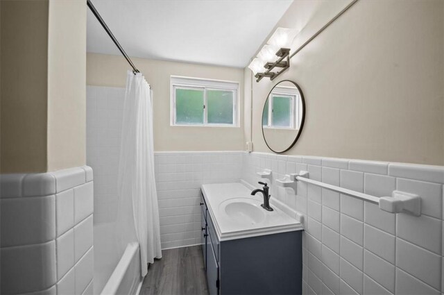 333 Woodland Way, Clemson, SC 29631 - bathroom featuring tile walls, vanity, wainscoting, shower / bath combo with shower curtain, and wood finished floors
