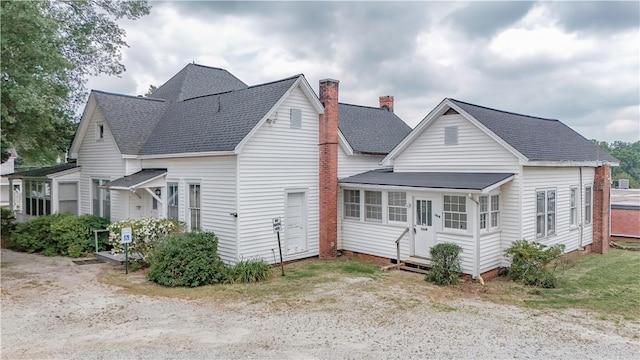 206 W N 1st St, Seneca, SC 29678 - view of side of home with entry steps, a shingled roof, and a chimney