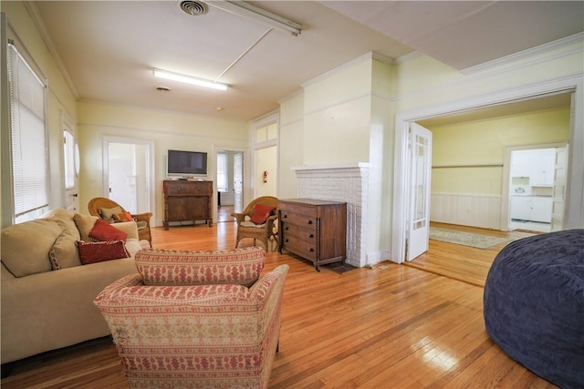 206 W N 1st St, Seneca, SC 29678 - living area featuring wood finished floors, crown molding, and wainscoting