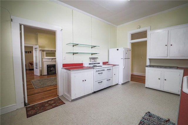 206 W N 1st St, Seneca, SC 29678 - kitchen with white appliances, crown molding, a brick fireplace, and white cabinets