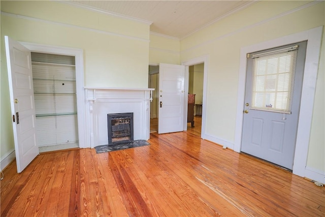 206 W N 1st St, Seneca, SC 29678 - unfurnished living room with ornamental molding, a fireplace with flush hearth, and light wood-type flooring