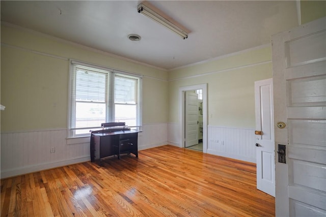 206 W N 1st St, Seneca, SC 29678 - empty room featuring a wainscoted wall, light wood-style floors, and crown molding