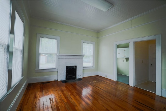 206 W N 1st St, Seneca, SC 29678 - unfurnished living room featuring crown molding, hardwood / wood-style flooring, a fireplace, and baseboards