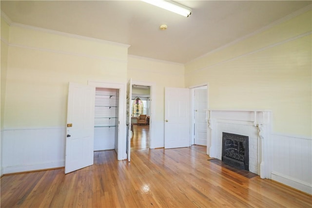 206 W N 1st St, Seneca, SC 29678 - unfurnished living room featuring light wood-type flooring, a fireplace with flush hearth, and ornamental molding