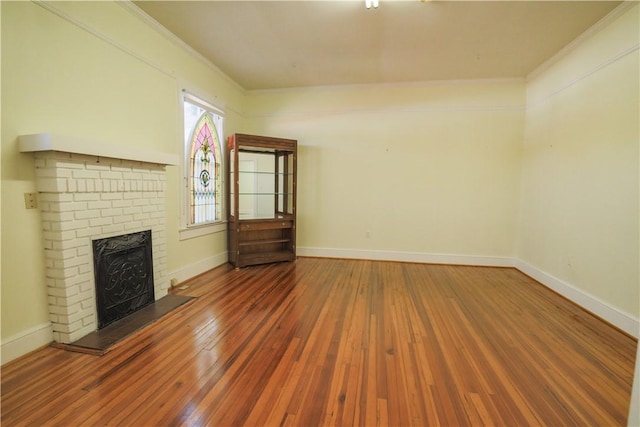 206 W N 1st St, Seneca, SC 29678 - unfurnished living room featuring a fireplace, wood-type flooring, and crown molding