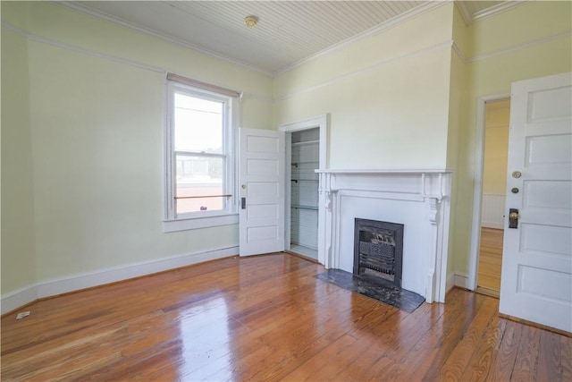 206 W N 1st St, Seneca, SC 29678 - unfurnished living room with crown molding, wood finished floors, and a fireplace with flush hearth