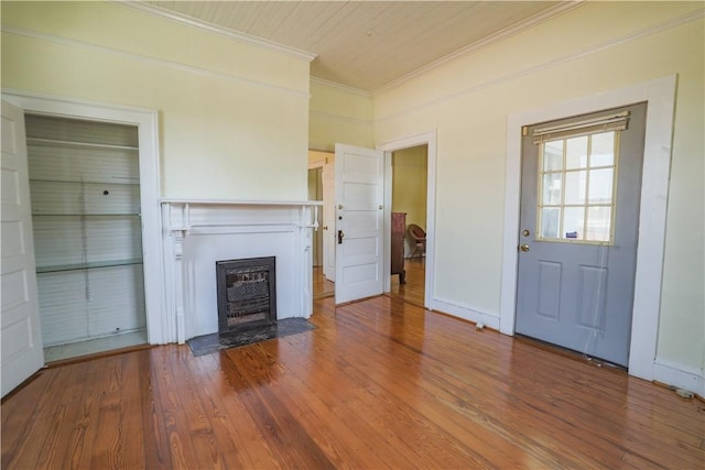 206 W N 1st St, Seneca, SC 29678 - unfurnished living room featuring crown molding, a fireplace with flush hearth, and wood finished floors