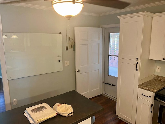 7 Carlisle Dr, Honea Path, SC 29654 - kitchen featuring dark countertops, crown molding, dark wood-type flooring, white cabinetry, and electric range