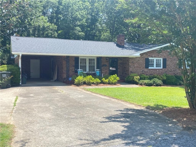 7 Carlisle Dr, Honea Path, SC 29654 - ranch-style house with a chimney, concrete driveway, a front yard, an attached carport, and brick siding