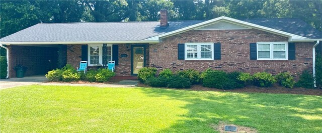 7 Carlisle Dr, Honea Path, SC 29654 - view of front facade with brick siding, a front lawn, and a chimney