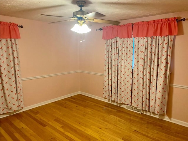 7 Carlisle Dr, Honea Path, SC 29654 - unfurnished room featuring wood finished floors, a textured ceiling, ceiling fan, and baseboards