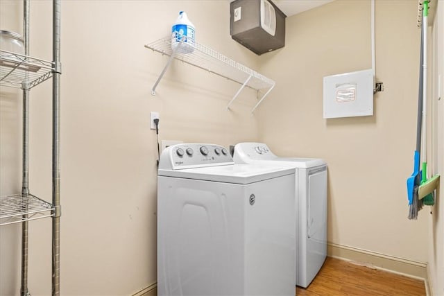 1814 Muscovy Way, Seneca, SC 29678 - laundry area with washer and clothes dryer, baseboards, and light wood-type flooring