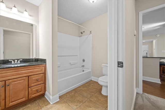 1814 Muscovy Way, Seneca, SC 29678 - bathroom featuring tub / shower combination, toilet, vanity, baseboards, and tile patterned floors