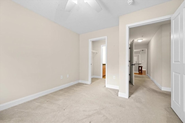 1814 Muscovy Way, Seneca, SC 29678 - unfurnished bedroom with light colored carpet, baseboards, and a walk in closet