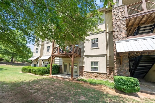 1814 Muscovy Way, Seneca, SC 29678 - view of front of house with stone siding, a balcony, and a front yard
