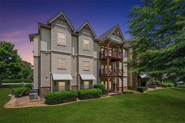 1814 Muscovy Way, Seneca, SC 29678 - view of front of house featuring stone siding, a front lawn, central AC unit, and a balcony
