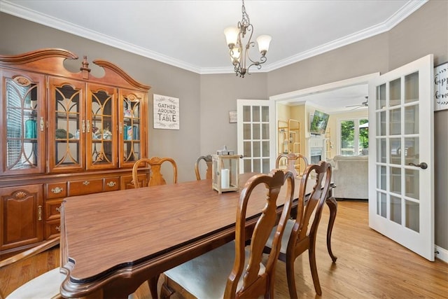 149 Summers Way, Seneca, SC 29672 - dining area featuring french doors, crown molding, a chandelier, light wood-type flooring, and ceiling fan