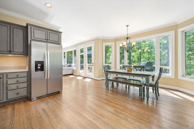 149 Summers Way, Seneca, SC 29672 - kitchen featuring stainless steel fridge with ice dispenser, light wood-style flooring, baseboards, ornamental molding, and light countertops