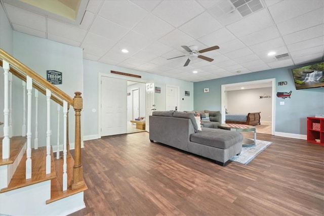 149 Summers Way, Seneca, SC 29672 - living room with wood finished floors, stairs, baseboards, ceiling fan, and a drop ceiling