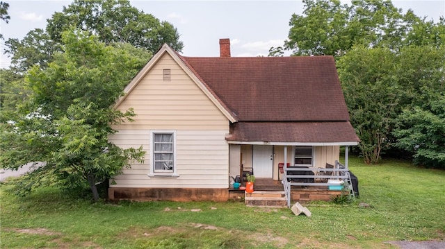 209 A St, Anderson, SC 29625 - view of front of property featuring a chimney, covered porch, a front lawn, and roof with shingles