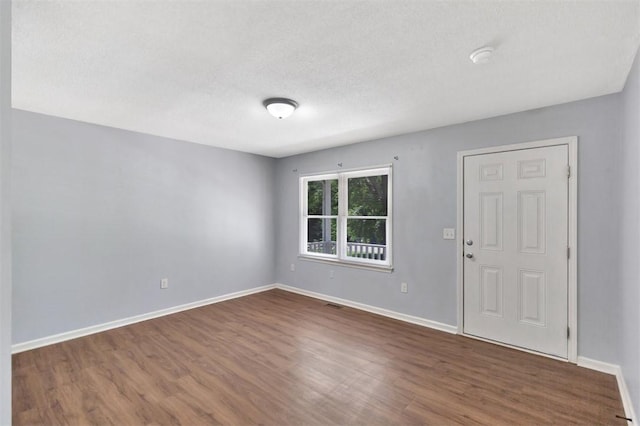 301 Wardlaw St, Anderson, SC 29624 - foyer entrance with dark wood-type flooring and baseboards