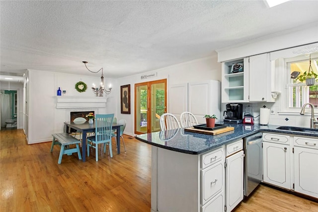 125 Brookwood Rd, Seneca, SC 29678 - kitchen with a sink, dishwasher, open shelves, a textured ceiling, and healthy amount of natural light