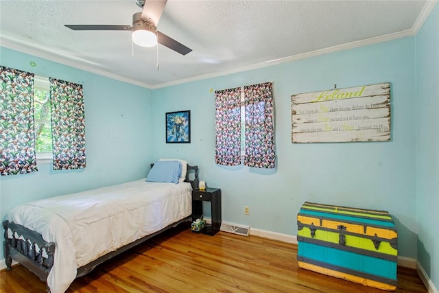 125 Brookwood Rd, Seneca, SC 29678 - bedroom featuring ornamental molding, wood finished floors, baseboards, a textured ceiling, and a ceiling fan