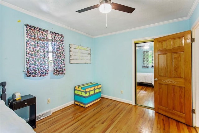 125 Brookwood Rd, Seneca, SC 29678 - bedroom with crown molding, light wood-style flooring, baseboards, and ceiling fan