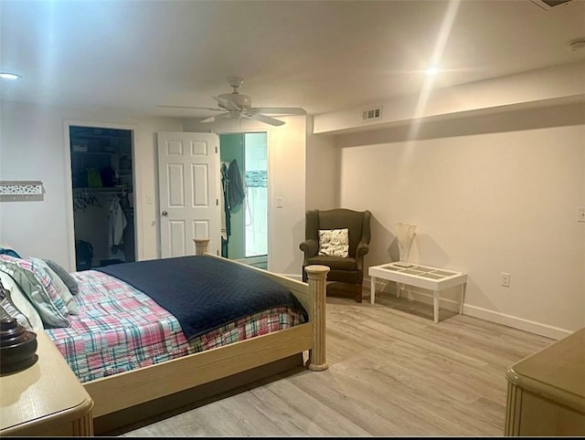 125 Brookwood Rd, Seneca, SC 29678 - bedroom featuring wood finished floors, a walk in closet, baseboards, and ceiling fan
