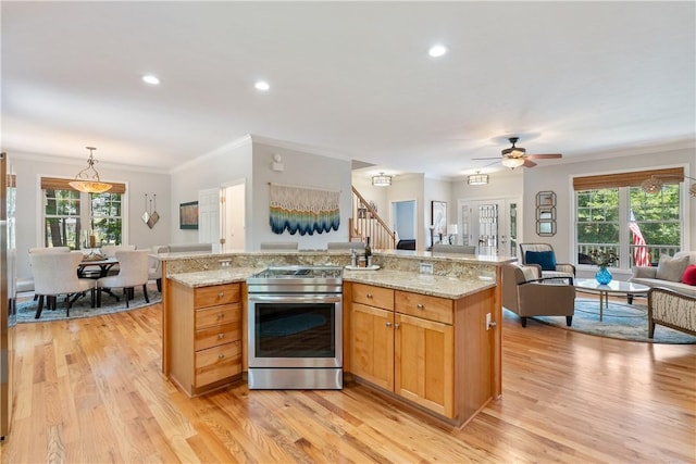 606 Lighthouse Ct, Seneca, SC 29672 - kitchen featuring stainless steel electric stove, open floor plan, plenty of natural light, crown molding, and light wood-style flooring