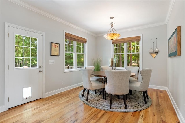 606 Lighthouse Ct, Seneca, SC 29672 - dining space featuring light wood finished floors, baseboards, and ornamental molding