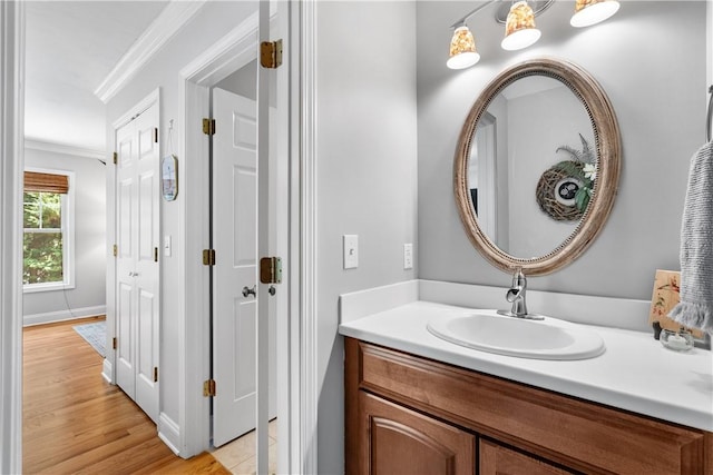 606 Lighthouse Ct, Seneca, SC 29672 - bathroom with ornamental molding, vanity, wood finished floors, and baseboards