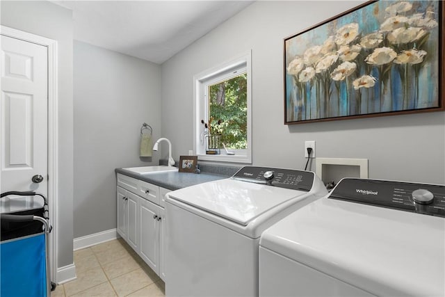 606 Lighthouse Ct, Seneca, SC 29672 - laundry room featuring cabinet space, washer and dryer, baseboards, and light tile patterned floors