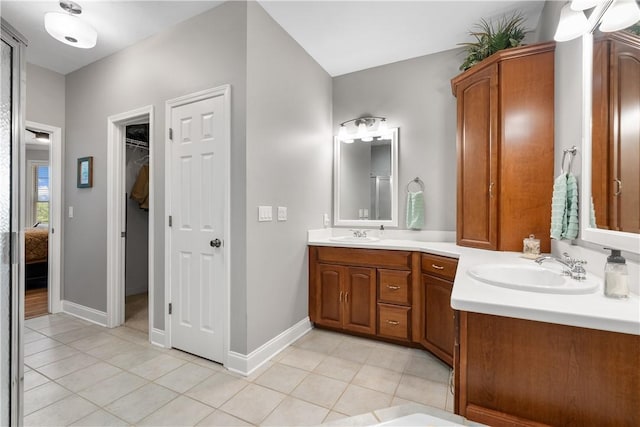 606 Lighthouse Ct, Seneca, SC 29672 - full bath with double vanity, tile patterned floors, and baseboards