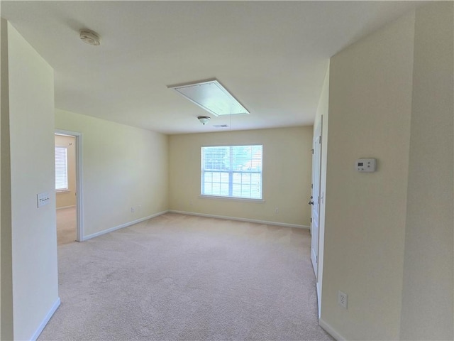 605 Spirit Mountain Ln, Easley, SC 29640 - unfurnished room with attic access, plenty of natural light, light colored carpet, and baseboards