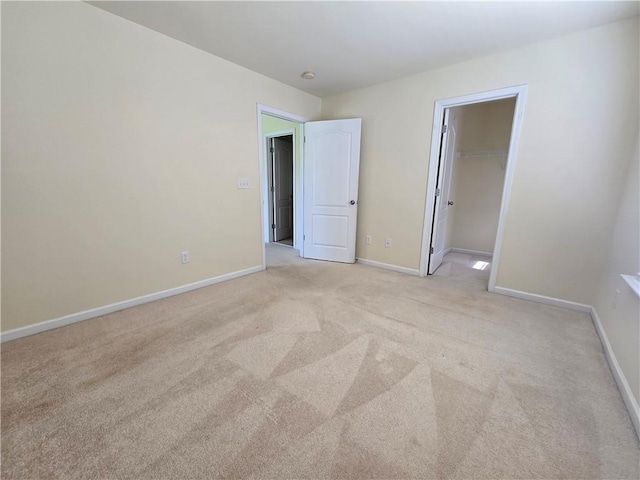 605 Spirit Mountain Ln, Easley, SC 29640 - unfurnished bedroom with light colored carpet, baseboards, and a spacious closet