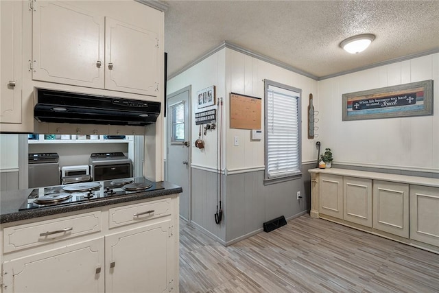 304 Samuel Rd, Honea Path, SC 29654 - kitchen with ventilation hood, black electric cooktop, a textured ceiling, ornamental molding, and light wood-style flooring