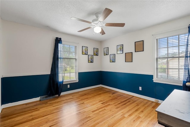 304 Samuel Rd, Honea Path, SC 29654 - spare room featuring wood finished floors, a textured ceiling, ceiling fan, and baseboards