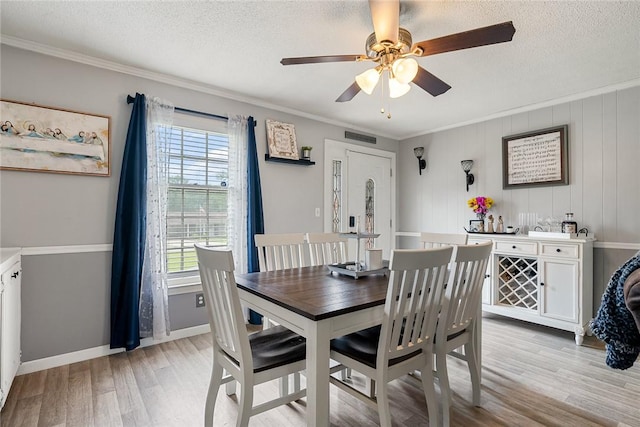 304 Samuel Rd, Honea Path, SC 29654 - dining room with light wood finished floors, ornamental molding, ceiling fan, a textured ceiling, and baseboards